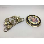Two brooches comprising a Victorian example decorated with a floral spray plus one other.