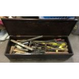 A large wooden toolbox and contents