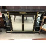 A Victorian ebonized credenza with a pair of mirro