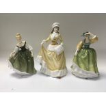 Three royal Doulton figures.