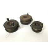 Three vintage wooden fishing reels