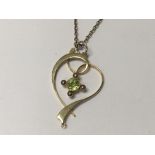 A 15carat Gold pendent set with seed pearl and Gre