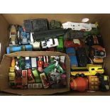 A box containing a collection of loose diecast veh