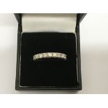 An 18ct white gold full eternity set with banded d