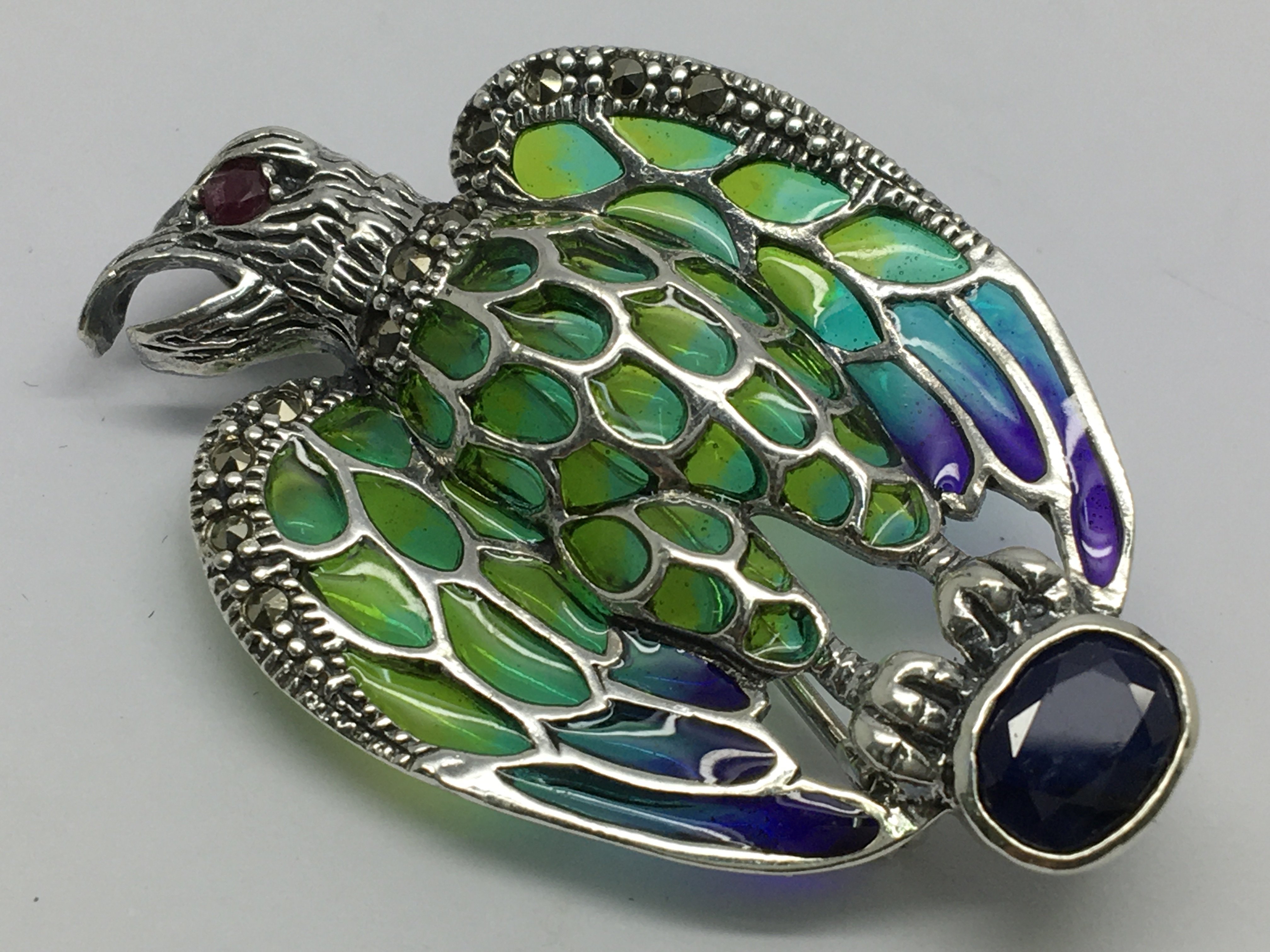 A silver eagle brooch/pendant set with sapphire, r