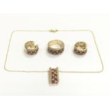 A 14ct gold and diamond jewellery set comprising a