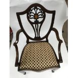 An Edwardian inlaid mahogany carver chair