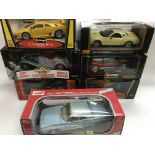 Fifteen boxed die cast 1:18 scale cars, mostly Bur