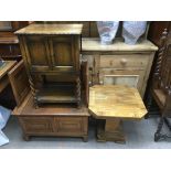 A small 1920s oak monks bench, oak pot cupboard an