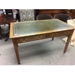 A 1940s oak and leather topped 2 drawer desk