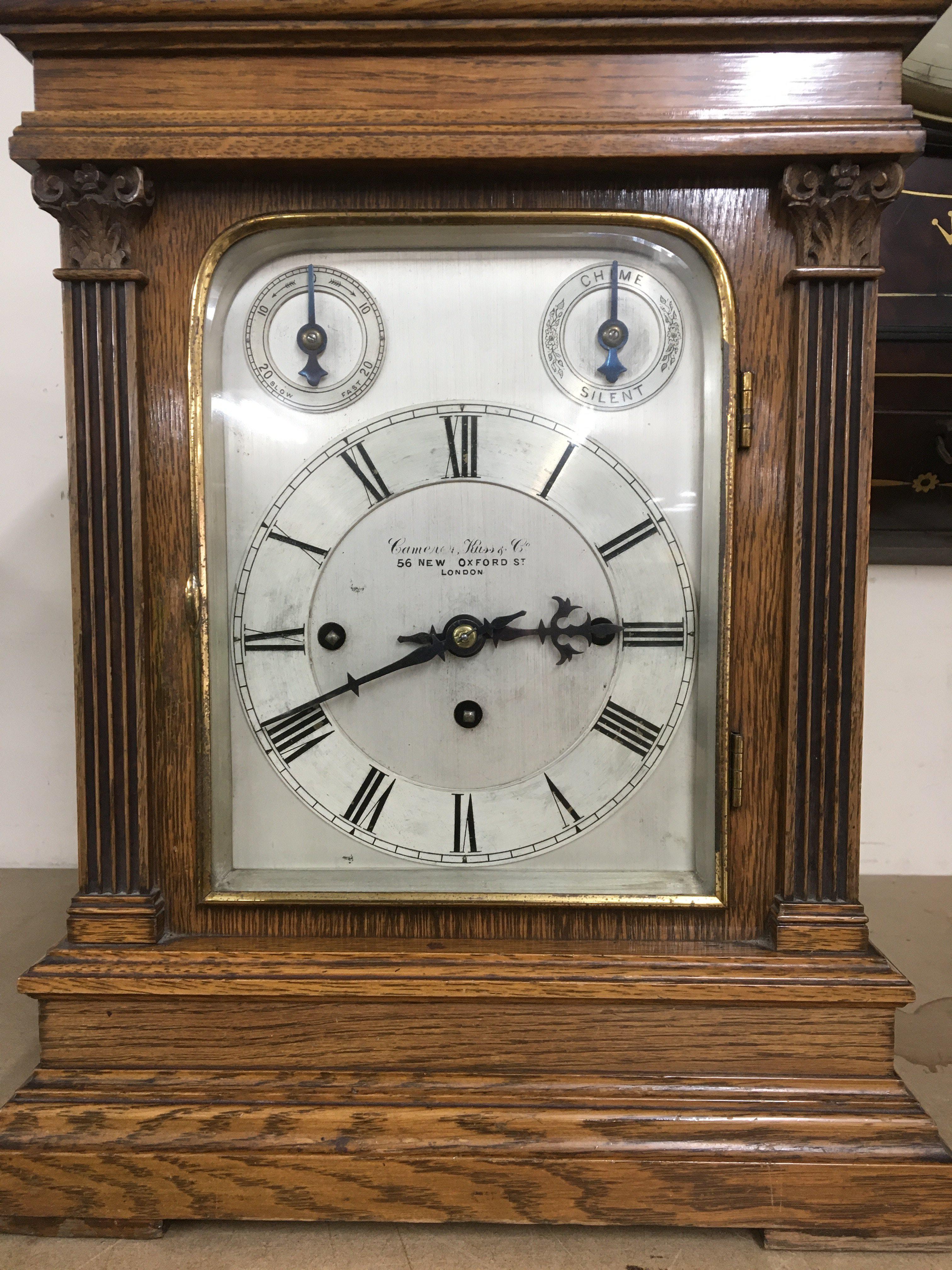 A oak cased mantle clock with musical movement str