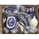 A box of mixed blue and white pottery.