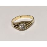 A gold ring set with an old cut solitaire diamond ring size L.