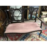 A Edwardian mahogany 2 seater settee.