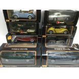 Fourteen boxed 1:18 scale die cast cars, mostly Bu