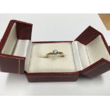 An 18ct solitaire diamond ring. 2.6g