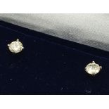 A pair of 18ct white gold RBC diamond studs, boxed