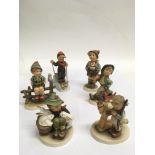 Six Hummel child figures