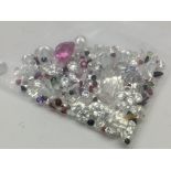 A bag of loose mixed stones including cubic zircon