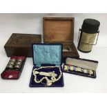 Two writing boxes, bone jewellery and cased napkin