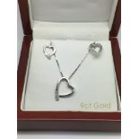 A 9ct white gold heart shaped pendant and matching earrings, approx 3.8g.