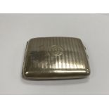 A silver cigarette case, Birmingham hallmarks.