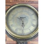 A 19th century oak case circular wall clock with verge movement. The brass dial with Roman