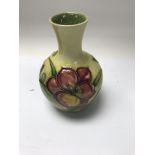 A Moorcroft bottle vase decorated with flowers and