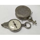 A WWII compass and map mileage calculator together with a silver pill box