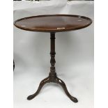 A George III tilt topped tripod wine table.