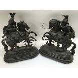 A pair of spelter Classical figures on horseback.A