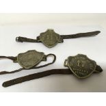 Three original brass Southend on sea Hawkers Permit badges with applied leather strap.