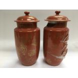 A pair of Oriental jars with covers with giltwork