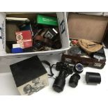 A box of cameras and accessories including a Polar