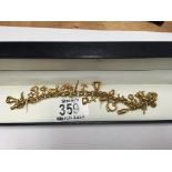 A 9ct gold Belcher style bracelet with charms