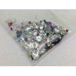 A bag of loose mixed stones including cubic zircon