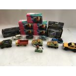 A collection of boxed and loose Diecast vehicles i