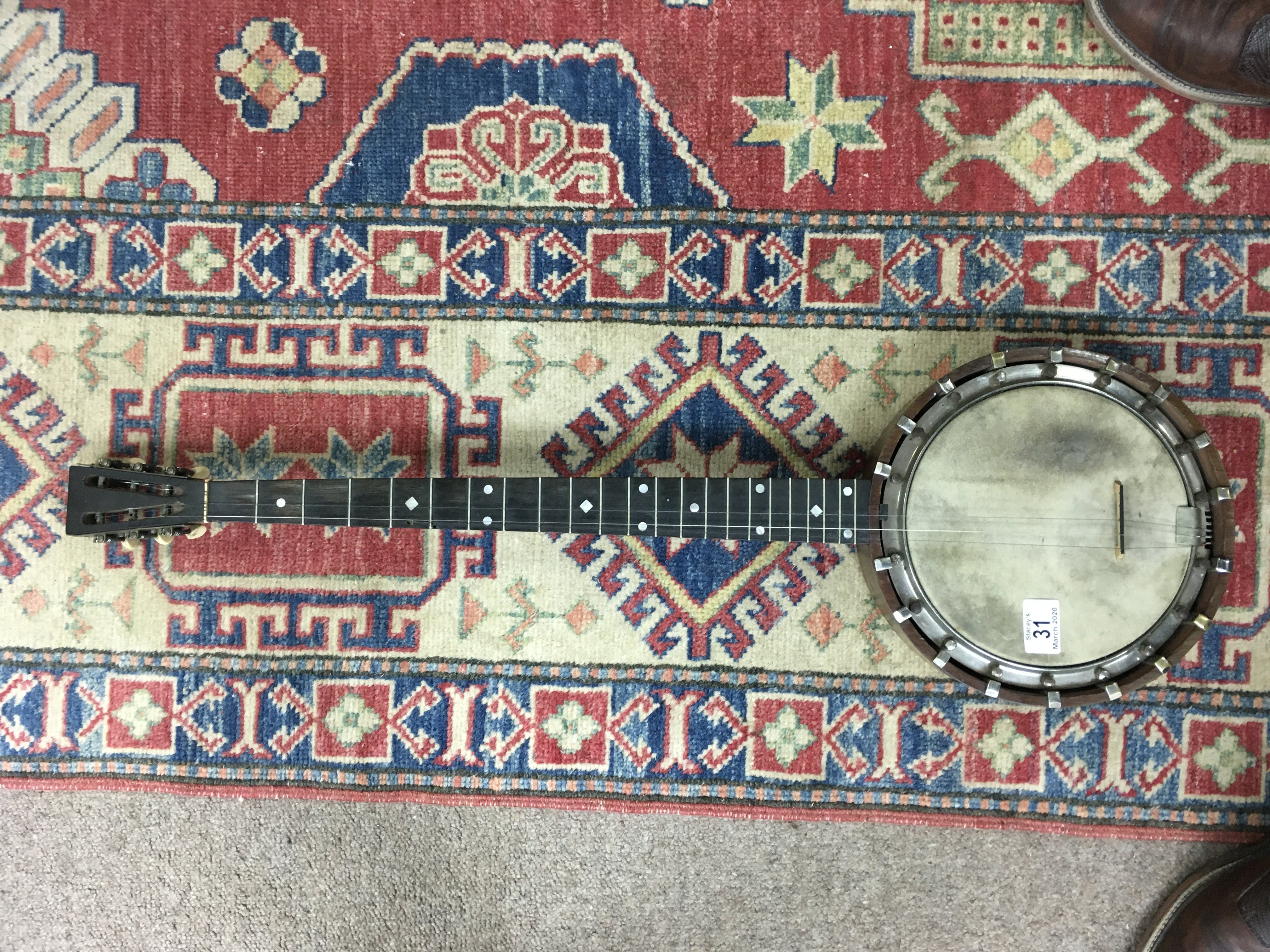 A Douglas and Co. 5 string banjo