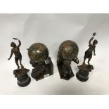 A pair of Atlas globe bookends plus a pair of shelter figure representing Vitality and Strength.