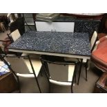 A circa 1960s/70s formica dining table, four chairs and a sideboard.