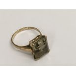 A 9ct gold ring set with a square cut citrine, approx M