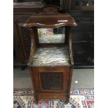 A carved front walnut and marble coal box.