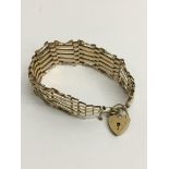 A 9ct gold gate bracelet with padlock clasp.Approx