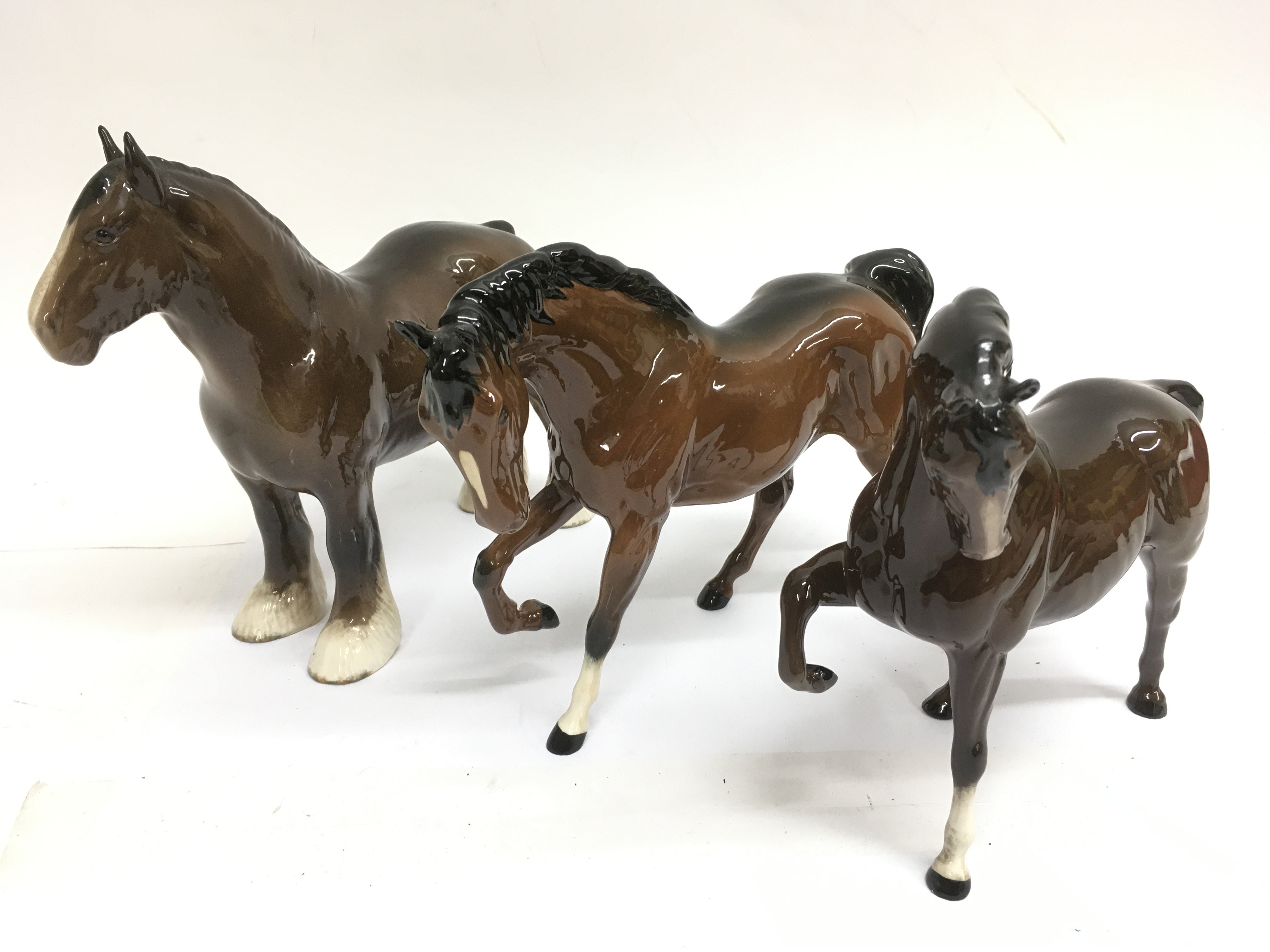 Three brown Beswick horses.No damage or restoratio