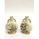 A small pair of Royal Worcester moon flasks decora