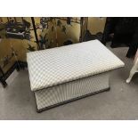 A 1930s upholstered ottoman.