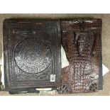 A 1920s leather photo album and a crocodile skin photo album.