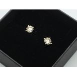 An 18ct white gold solitaire, pair of stud earring