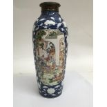 A 19th Chinese vase with raised floral decoration the decorated panels depicting figures at leisure,