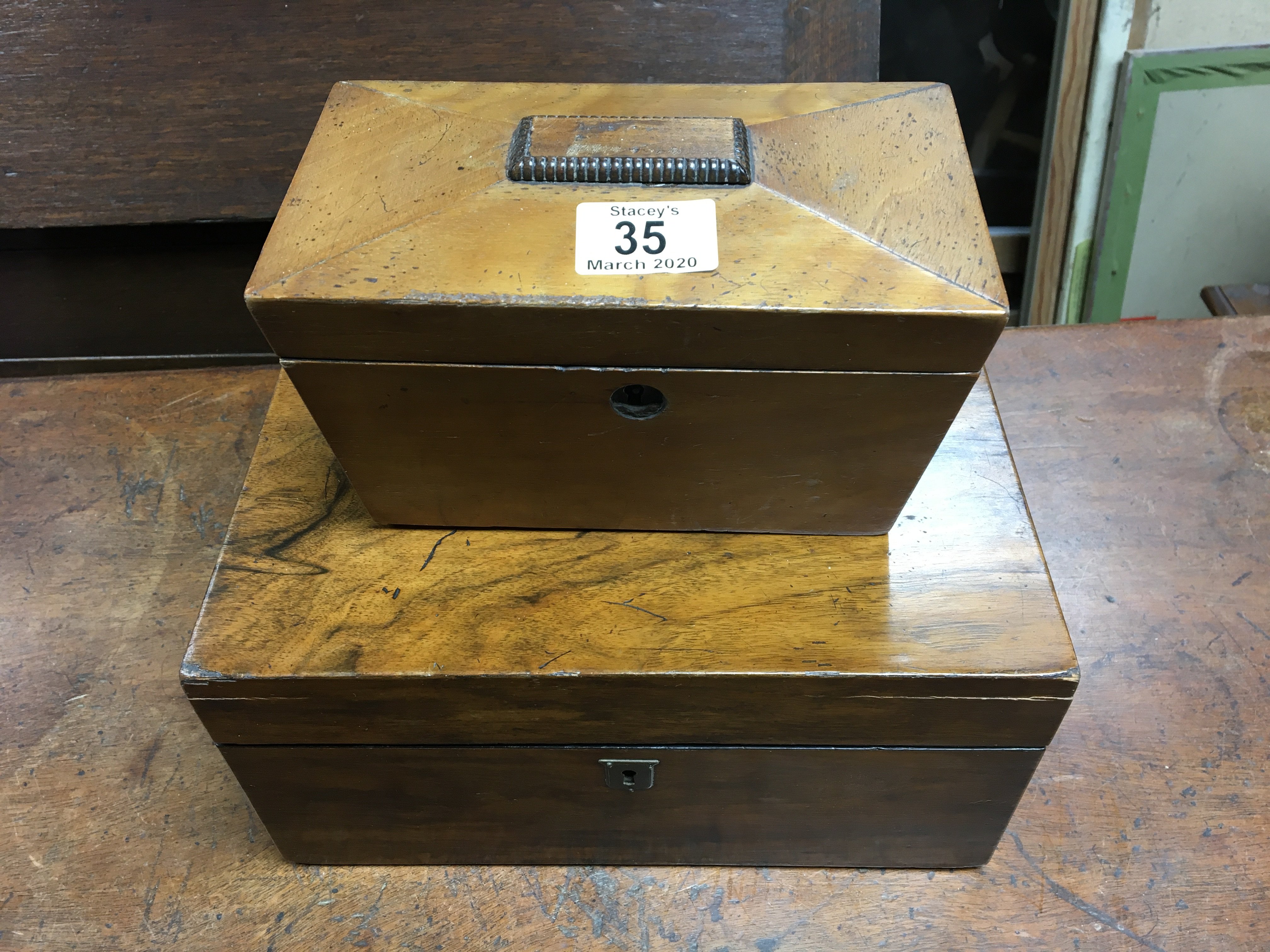 A small sarcophagus shaped tea caddy together with